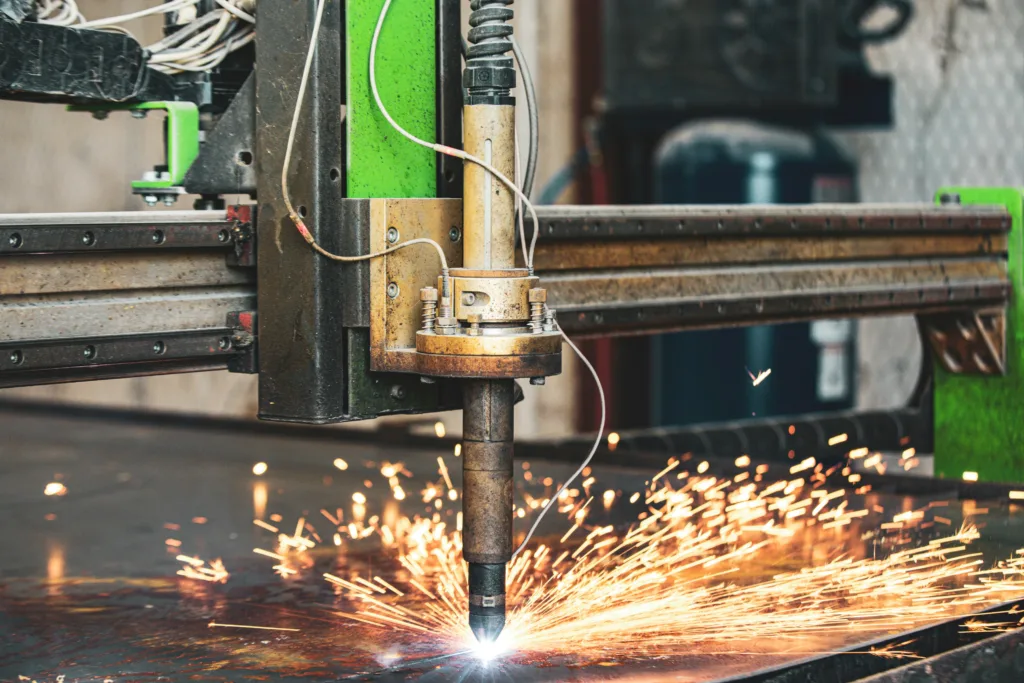 sparks flying from CNC plasma table cutting steel